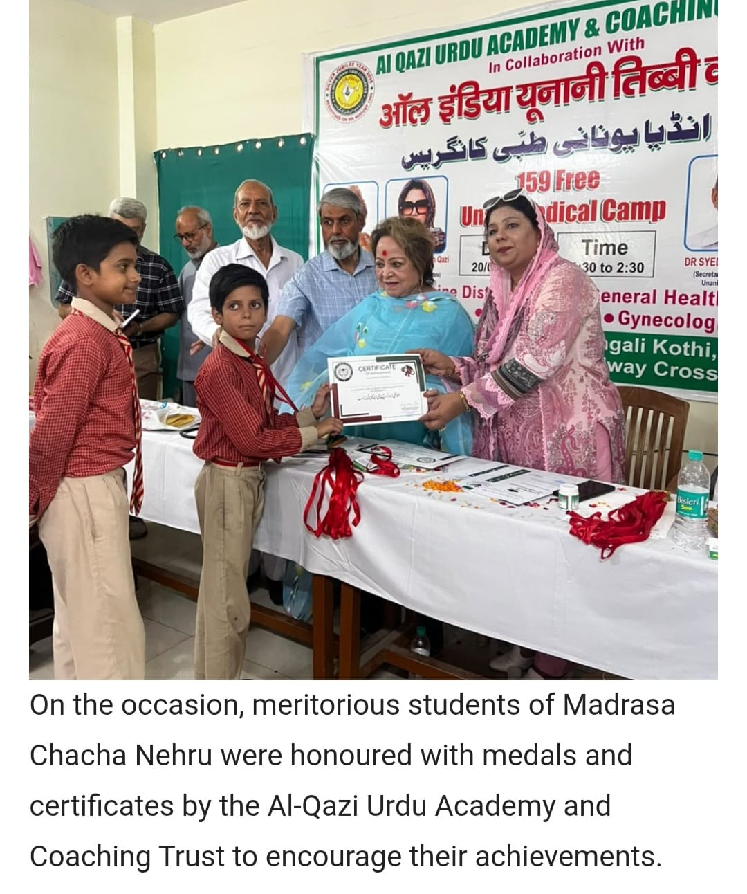Honoring young meritorious boys of Madrasa Chacha Nehru with medals and certificates