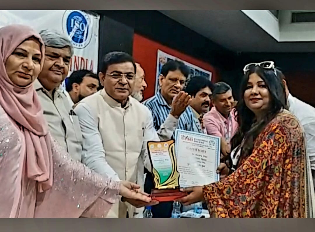 Receiving the ISO-certified Foundation Day Award of Excellence plaque and certificate